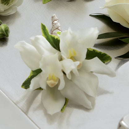 White Mini Cymbidium Boutonniere –  Nacogdoches Floral Company, Nacogdoches TX